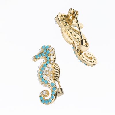 Barbieri Spilla Cavalluccio Metallo Gold e Zirconi Turchesi